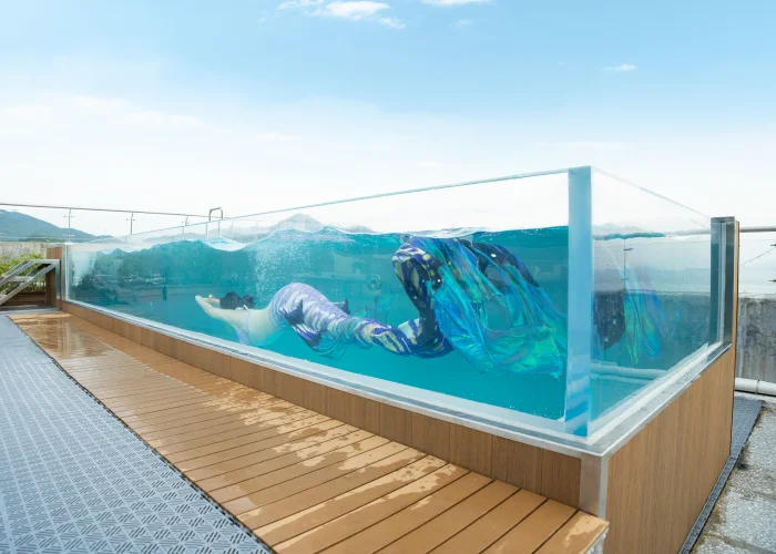 glass-walled swimming pool